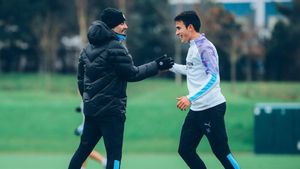 Eric Garcia junto a Pep Guardiola Eric Garcia junto a Pep Guardiola