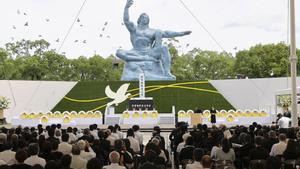 Doves fly over the Peace Statue during a ceremony commemorating the 77th anniversary of the bombing of the city at Nagasaki Peace Park in Nagasak