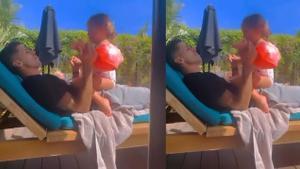 Cancelo le enseña a su hija el himno del Barça