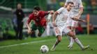Trincaco recibe una falta de Reguilón en el partido entre Portugal y España