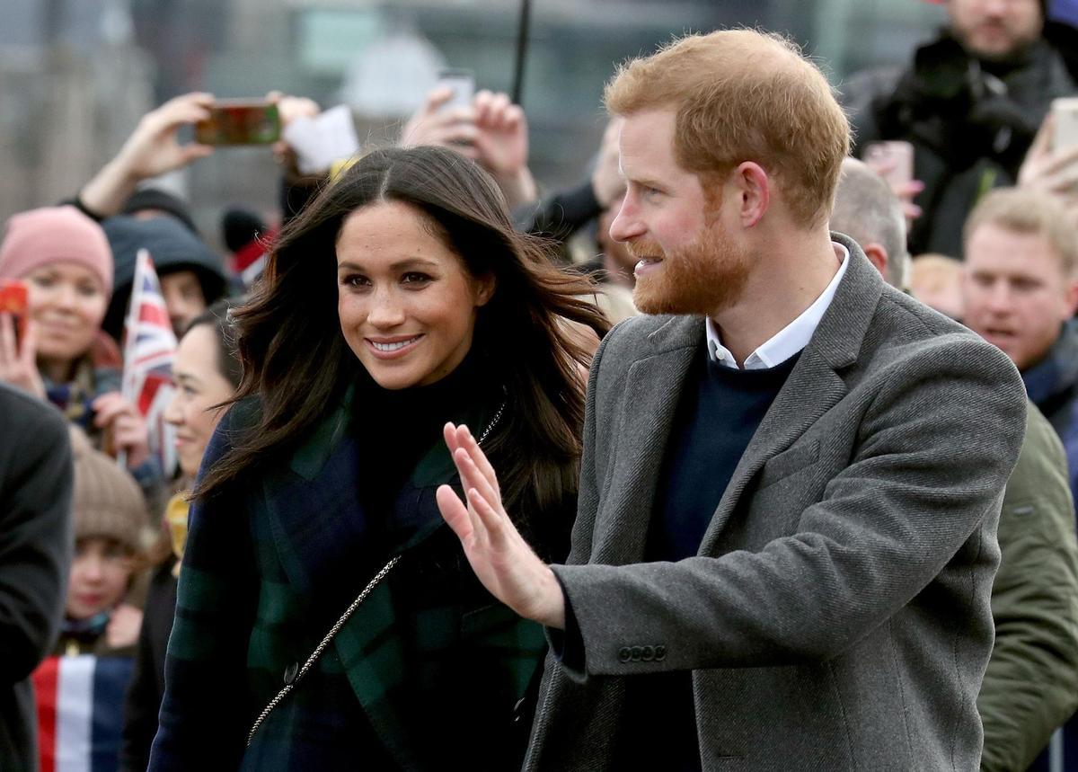 FILE PHOTO: Meghan Markle and Britains Prince Harry, meet members of the public during a walkabout on the esplanade at Edinburgh Castle