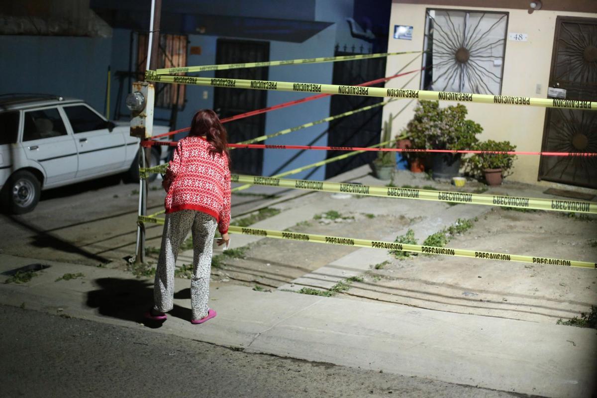 23 January 2022, Mexico, Tijuana: The home of murdered journalist Lourdes Maldonado is on lockdown during a police operation. Maldonado was shot dead Sunday in her car in the city on the US border. Photo: Omar Martinez/dpa
